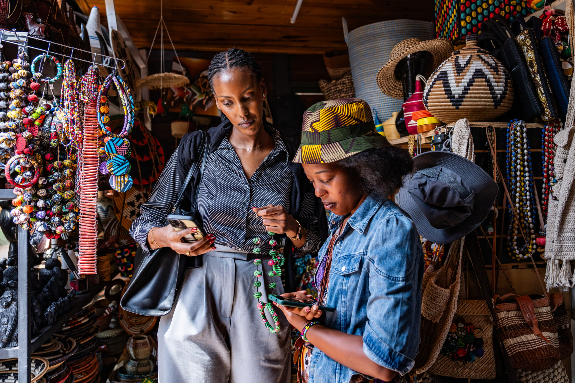 A woman purchases a necklace using mobile money in Rwanda.